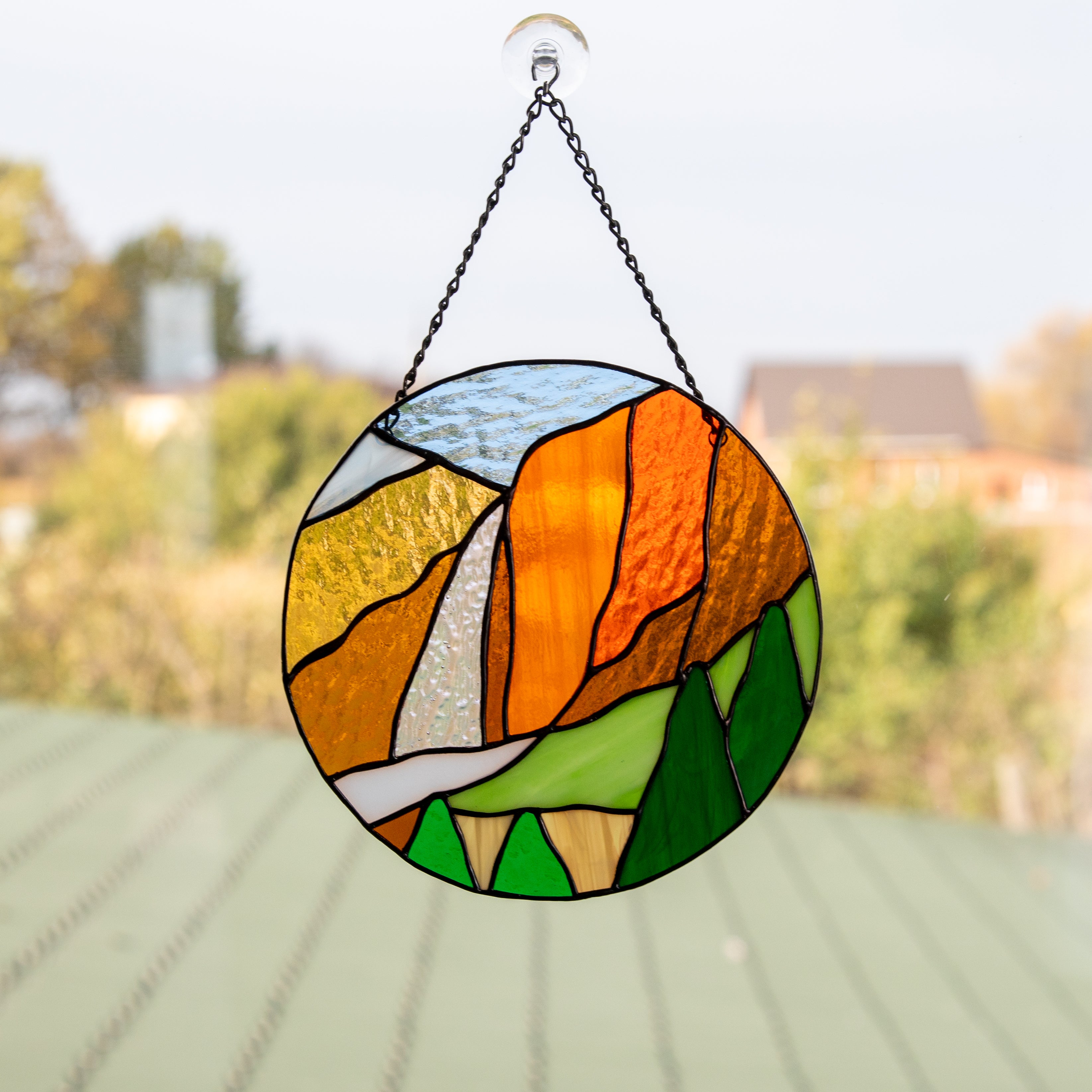 Stained glass round panel depicting Yosemite National Park