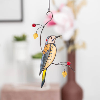 Northern Flicker sitting on the branch with leaves and berries suncatcher of stained glass