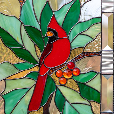 Zoomed stained glass panel depicting a red cardinal