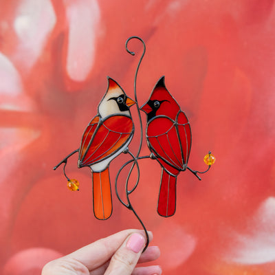Colourful stained glass cardinals in love on the branch suncatcher