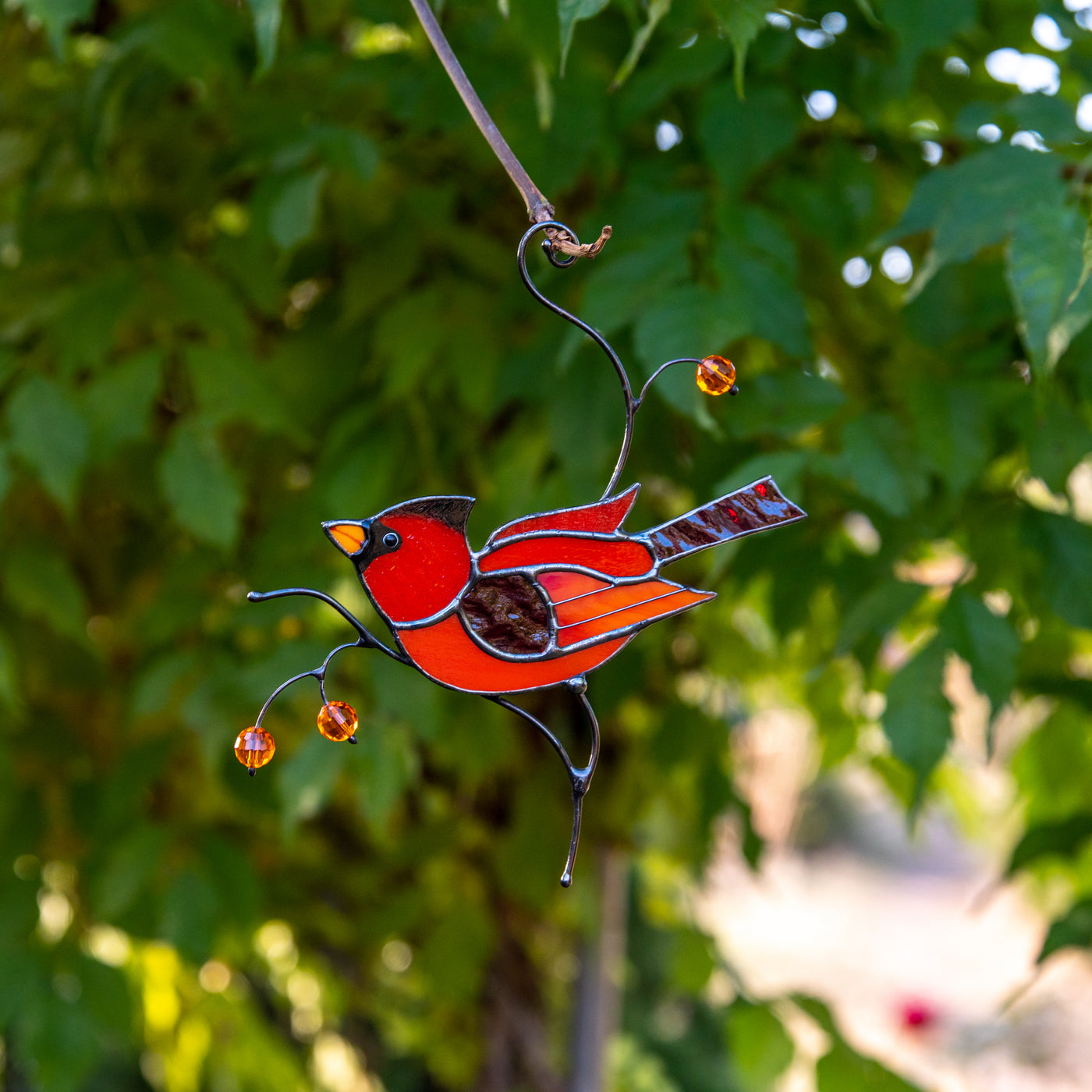 Male red winter bird suncatcher made of stained glass