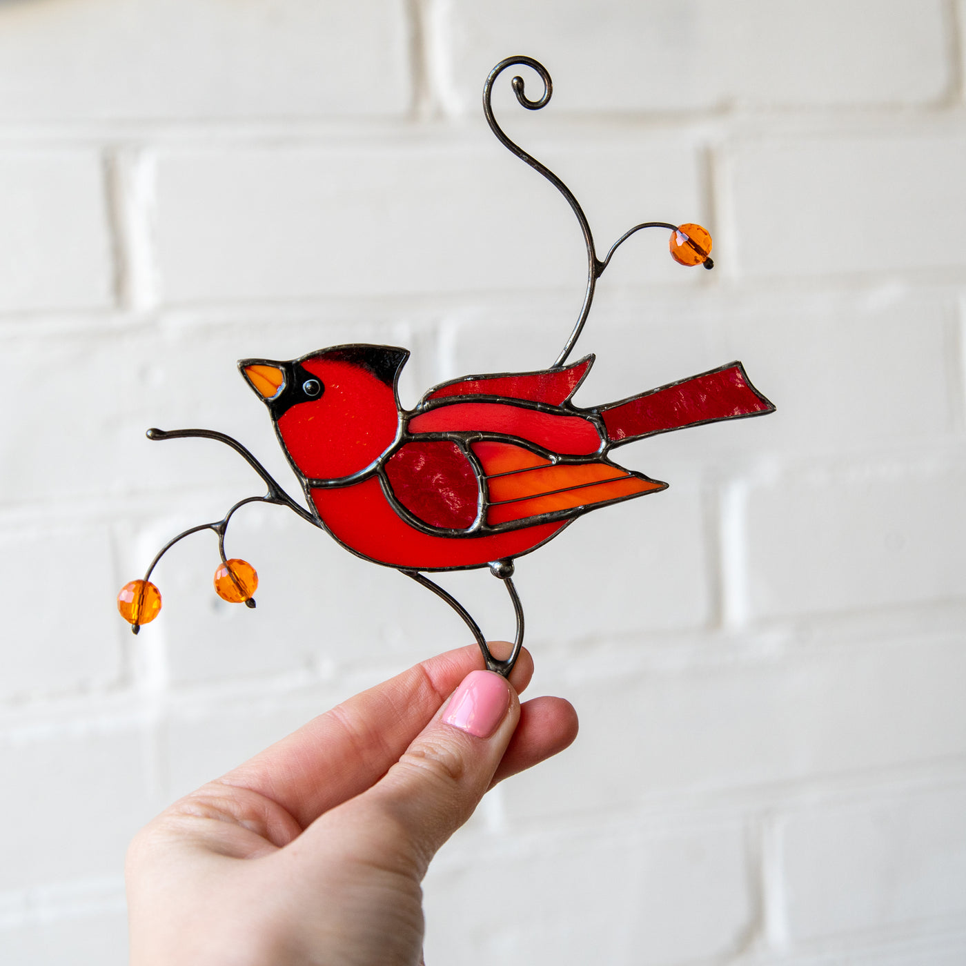 Male red winter bird suncatcher of stained glass for home decor