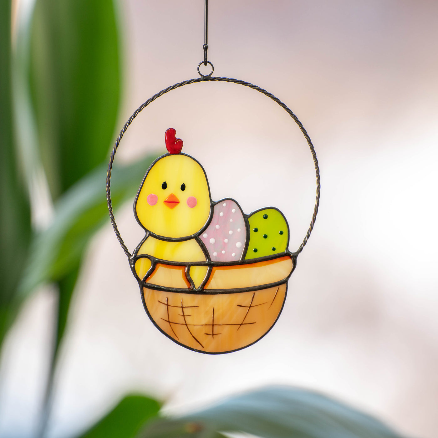Stained glass yellow chick with eggs in a basket suncatcher for Easter