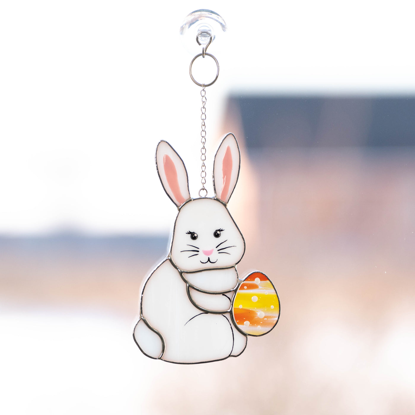 Stained glass bunny with an orange egg suncatcher for Easter 