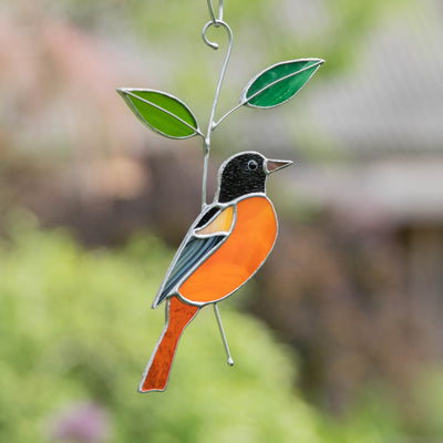 Stained glass suncatcher of Baltimore Oriole bird