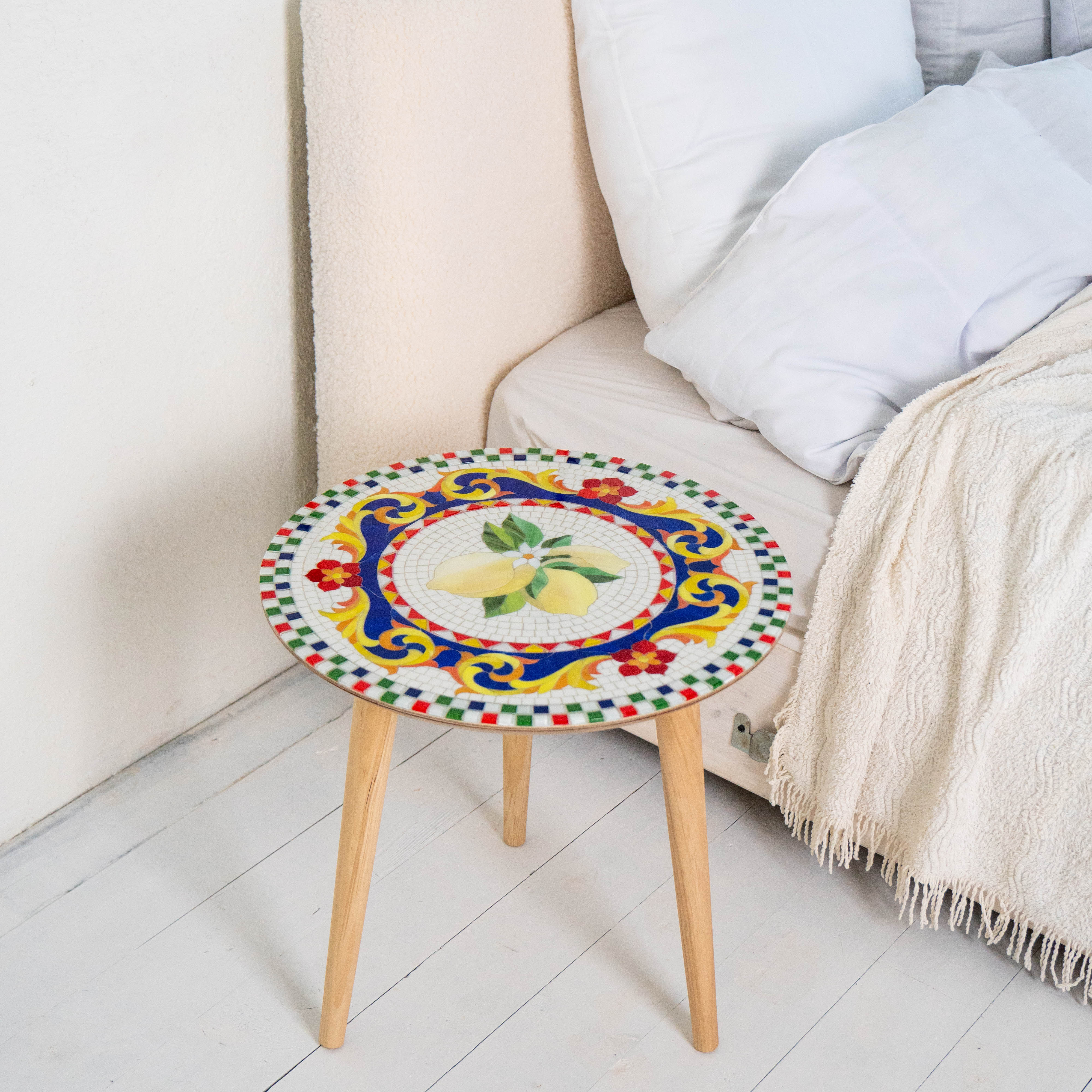 Round mosaic table of stained glass depicting lemons
