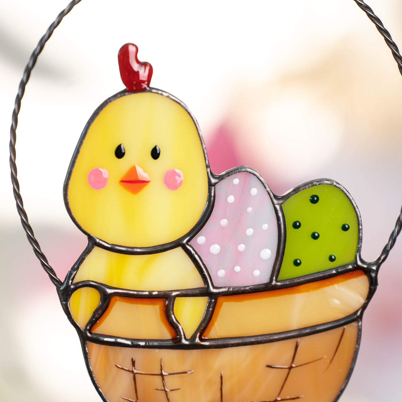 Zoomed chick with eggs in a basket suncatcher