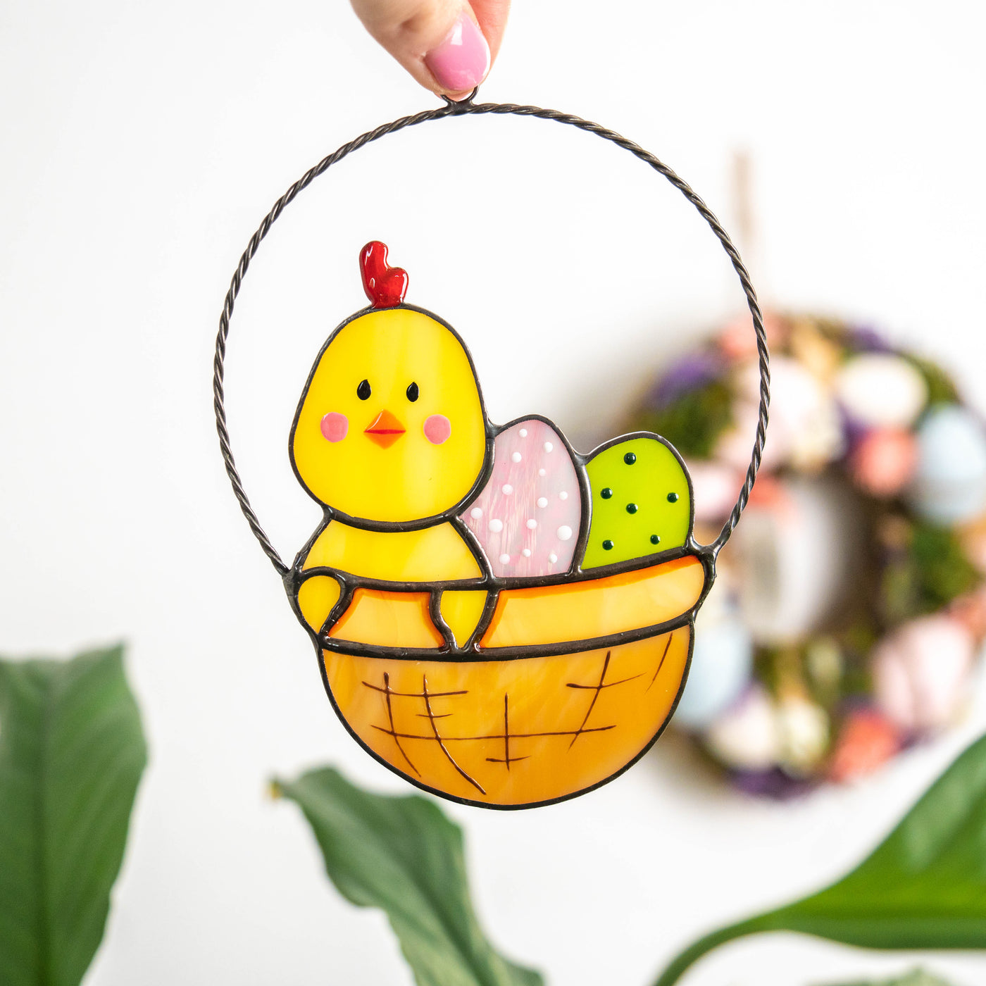 Stained glass Easter suncatcher of chick with eggs in a basket