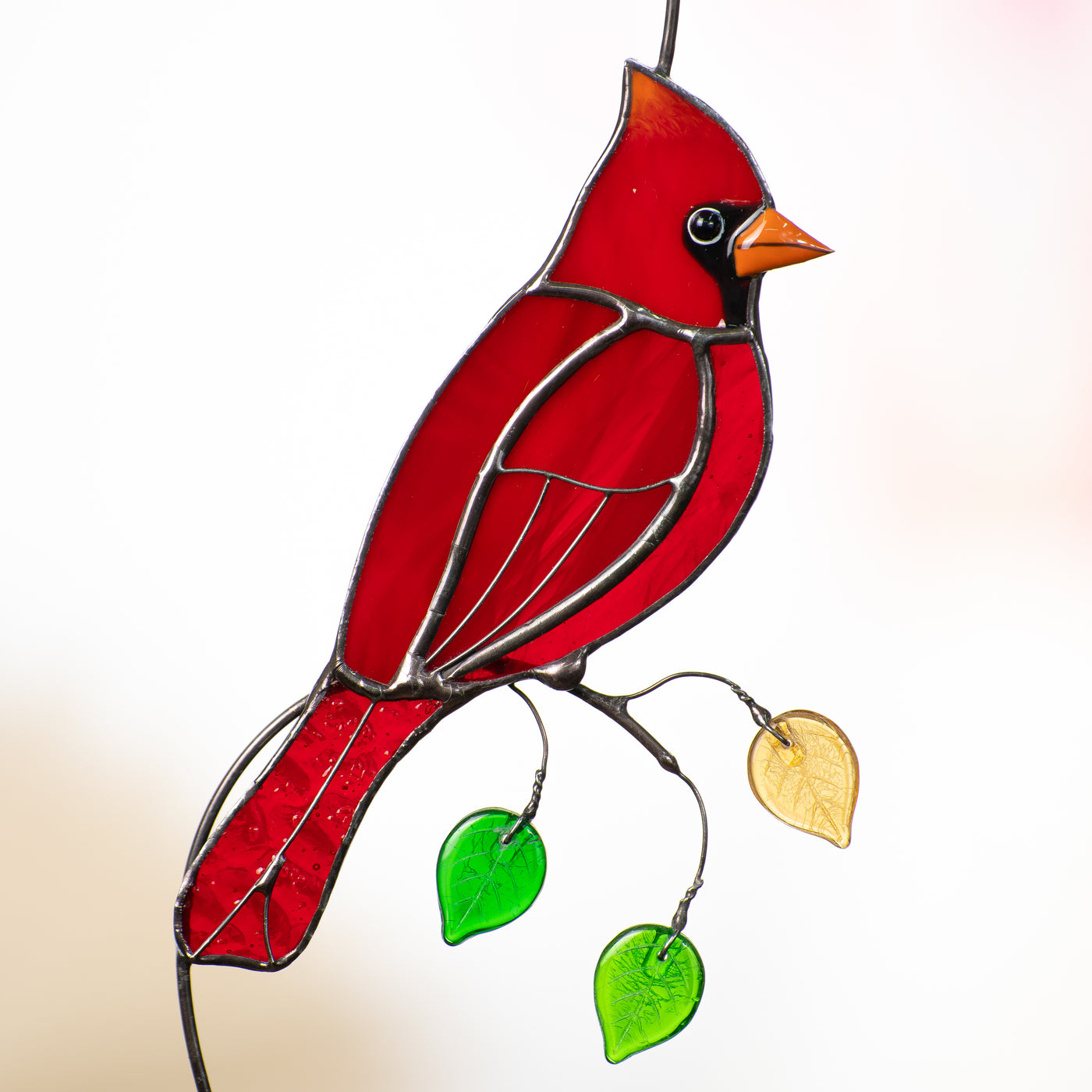Zoomed stained glass red bird suncatcher