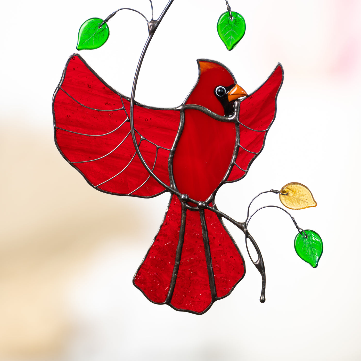 Zoomed stained glass flying red winter bird