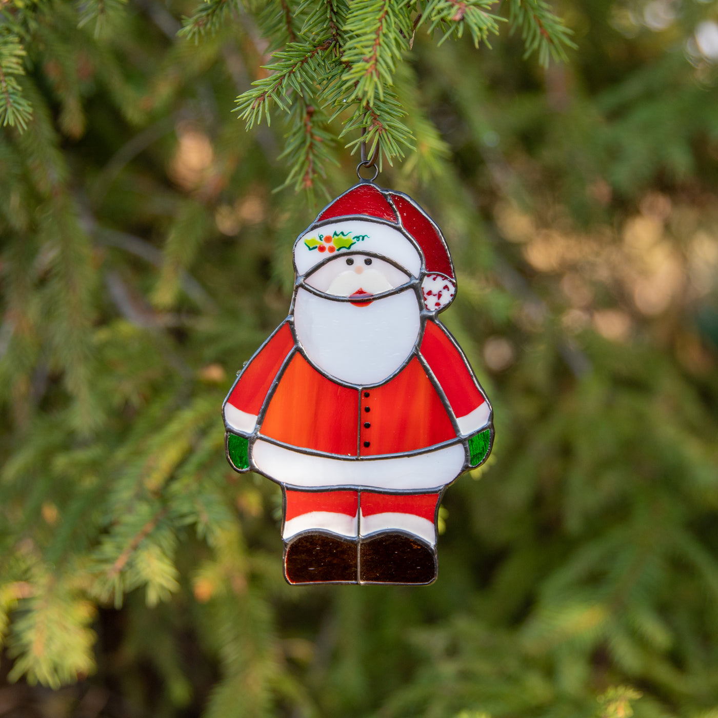 Santa Claus suncatcher as a New Year Tree decoration