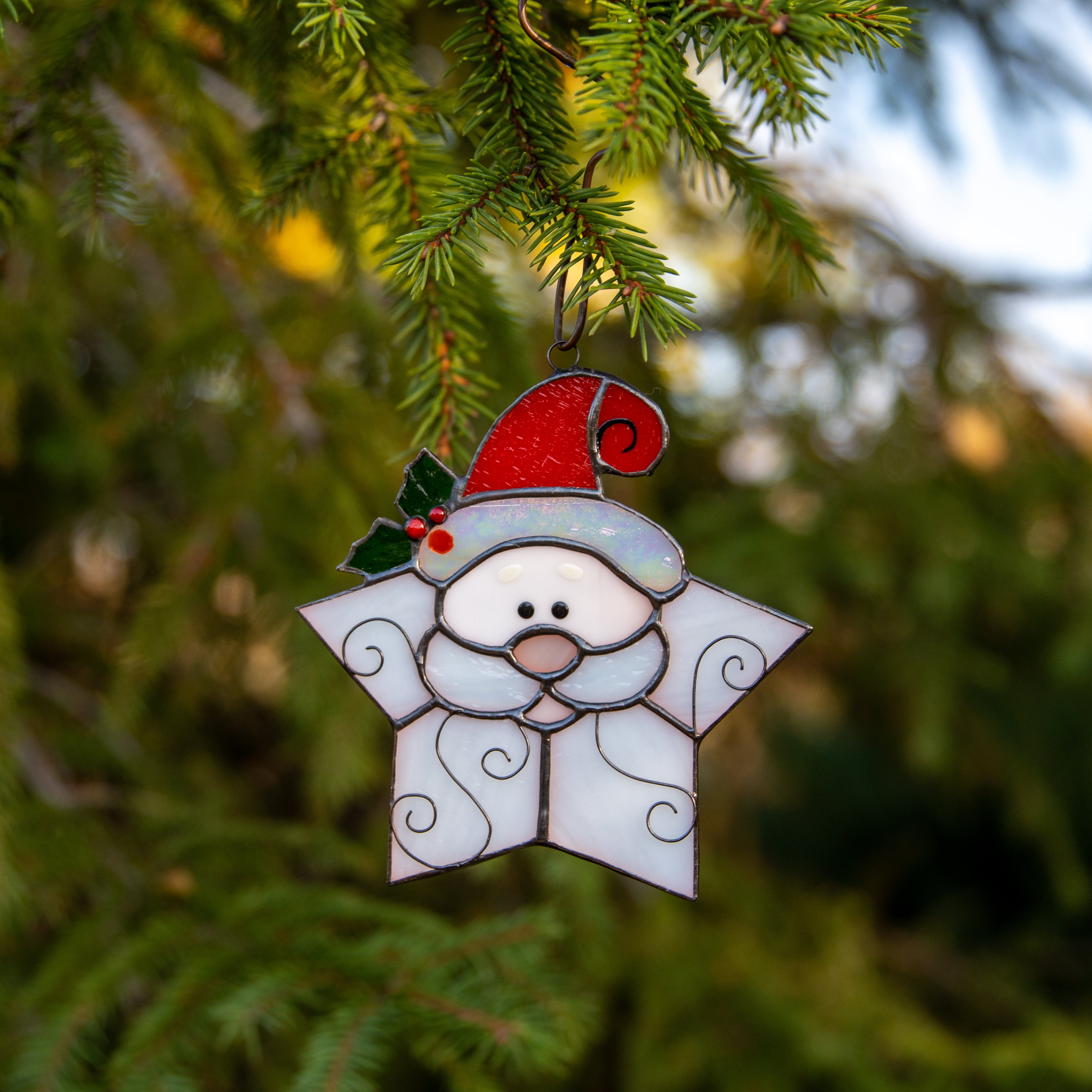 Stained glass snowflake Santa suncatcher used as a New Year Tree decor