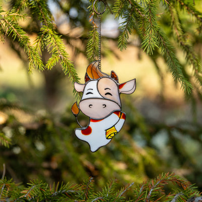 Happy cute bull stained glass window hanging as a New Year Tree decoration