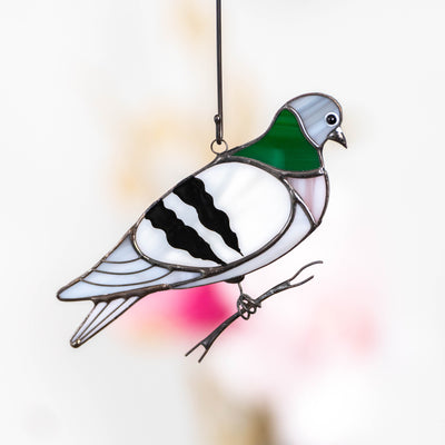 Stained glass pigeon on the branch suncatcher for window