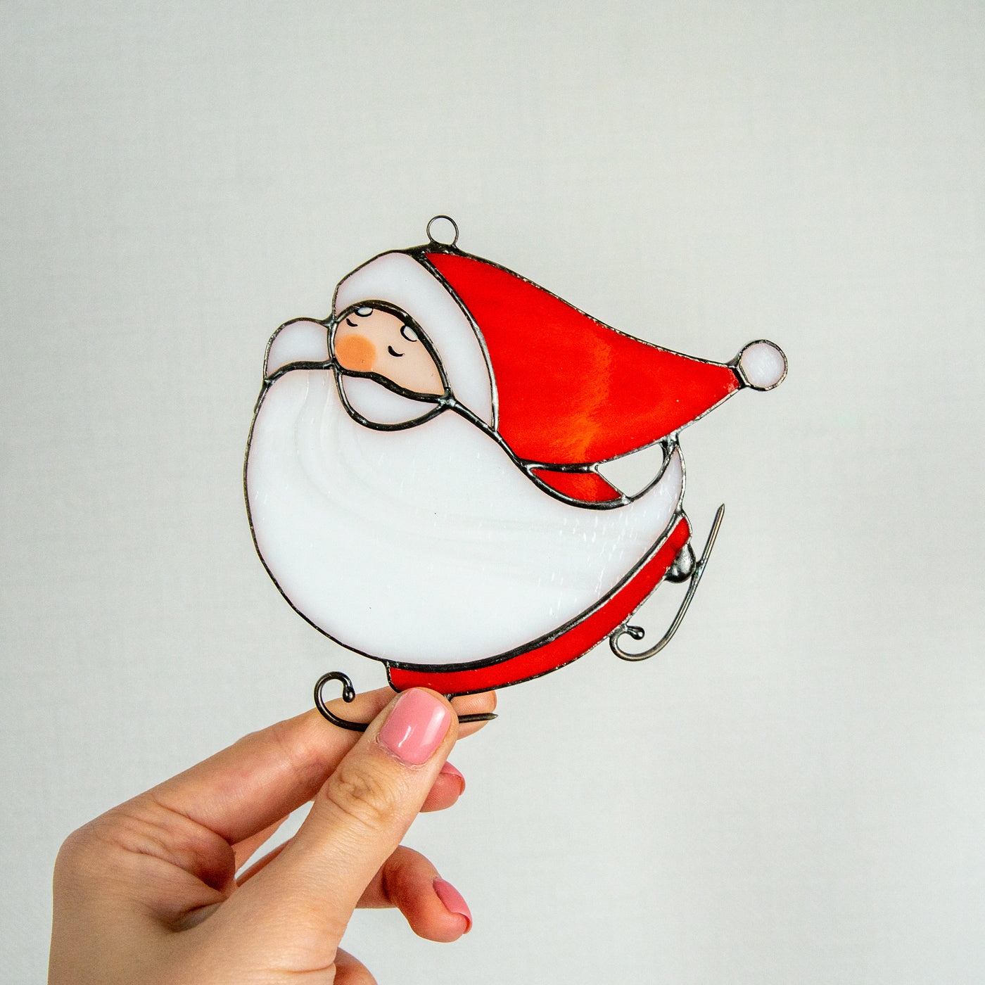 Stained glass skating Santa suncatcher for window decor