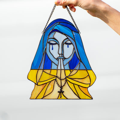 Stained glass praying and crying woman symbolising Ukraine window hanging 