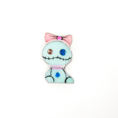 Stained glass turquoise toy with pink bow on the head brooch