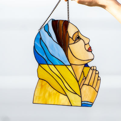 Stained glass window panel in the shape of Ukrainian praying woman 