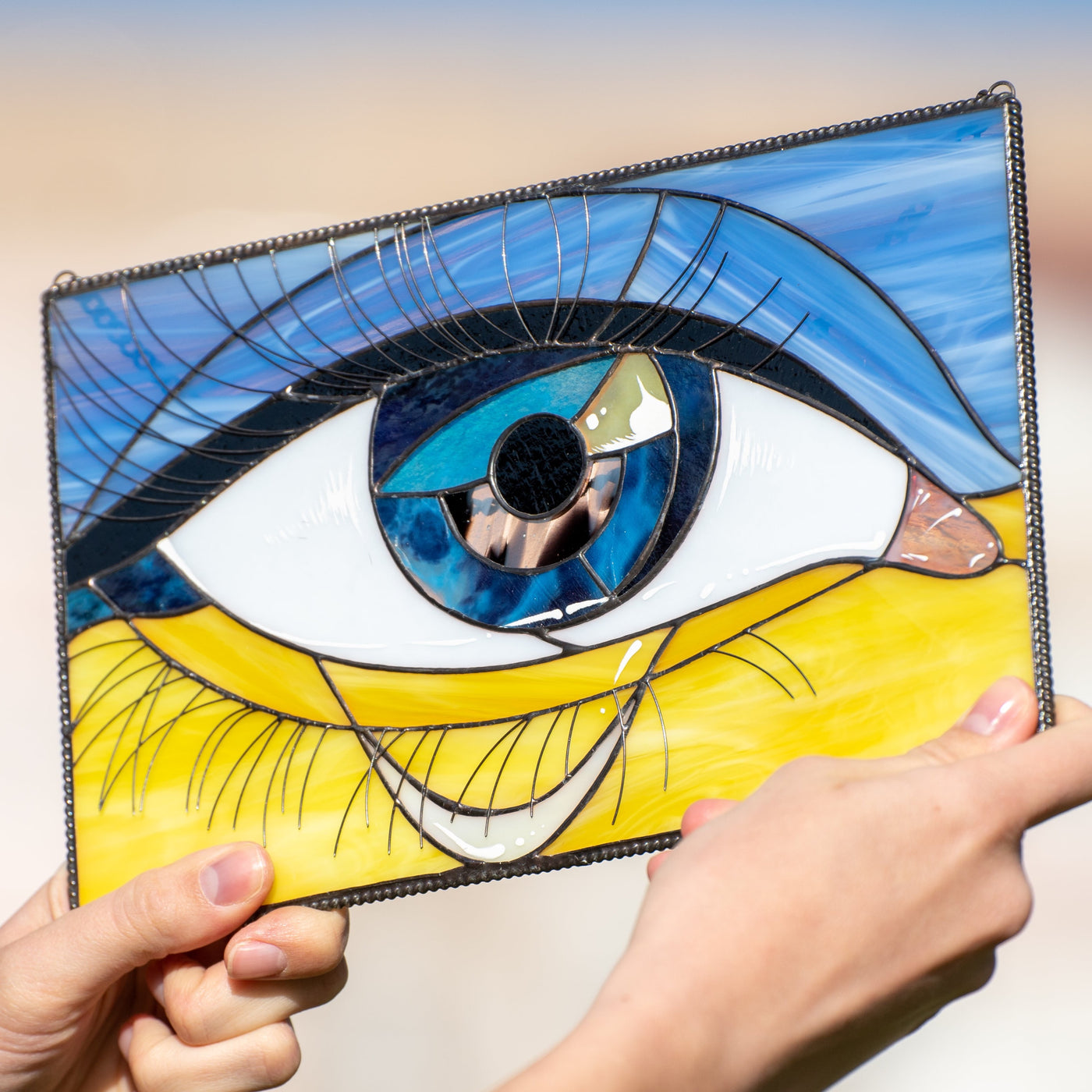 Stained glass Ukrainian flag with the eye in the middle
