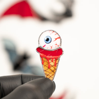 Zoomed stained glass ice-cream with the torn out eye pin