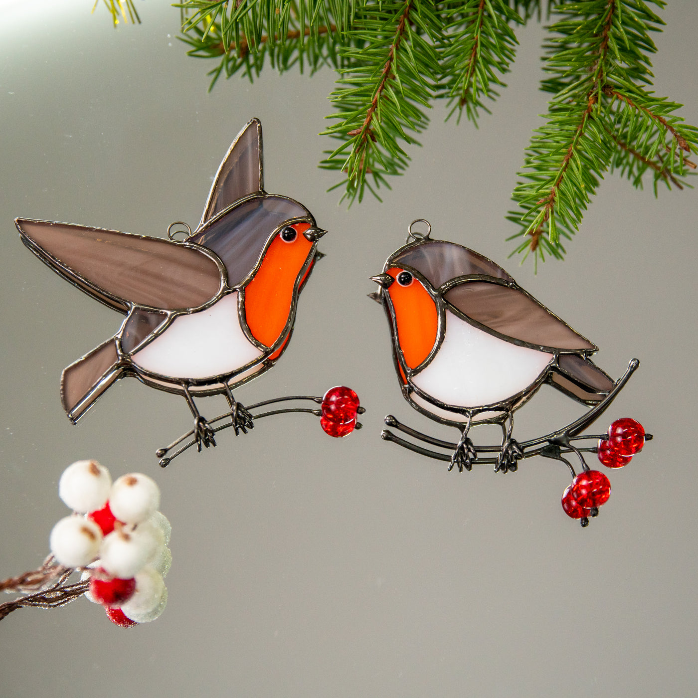 Set of two stained glass robin birds looking at each other 