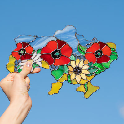 Stained glass map of Ukraine with bright flowers 