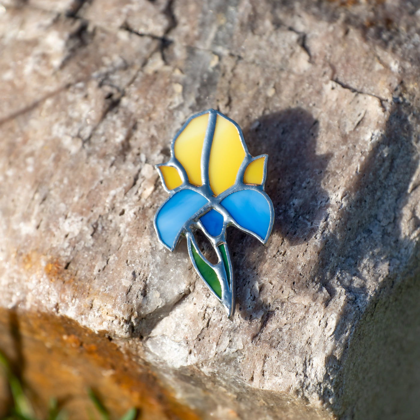 Zoomed stained glass blue and yellow iris pin