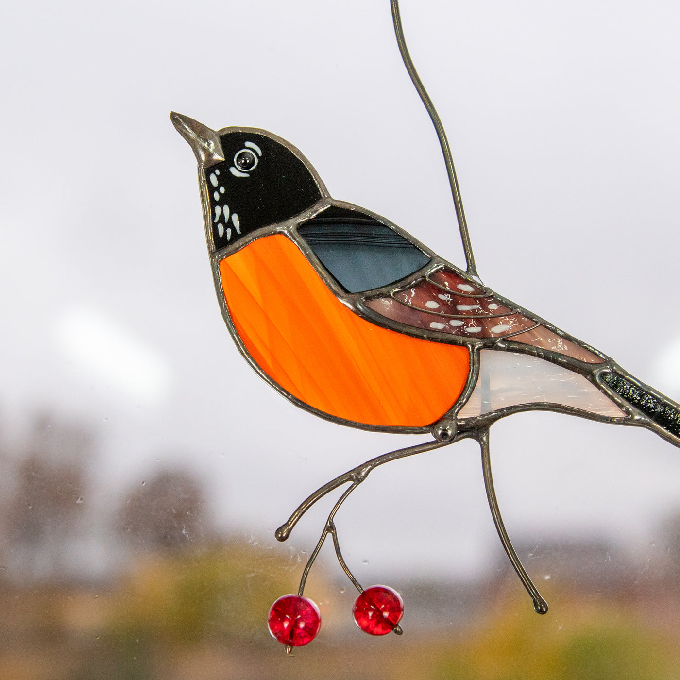 Zoomed stained glass American robin bird
