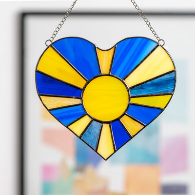 Zoomed stained glass Ukrainian heart with the sun-rays inside of it suncatcher