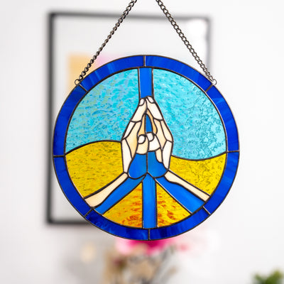 Zoomed stained glass peace sign in the colours of Ukrainian flag window panel