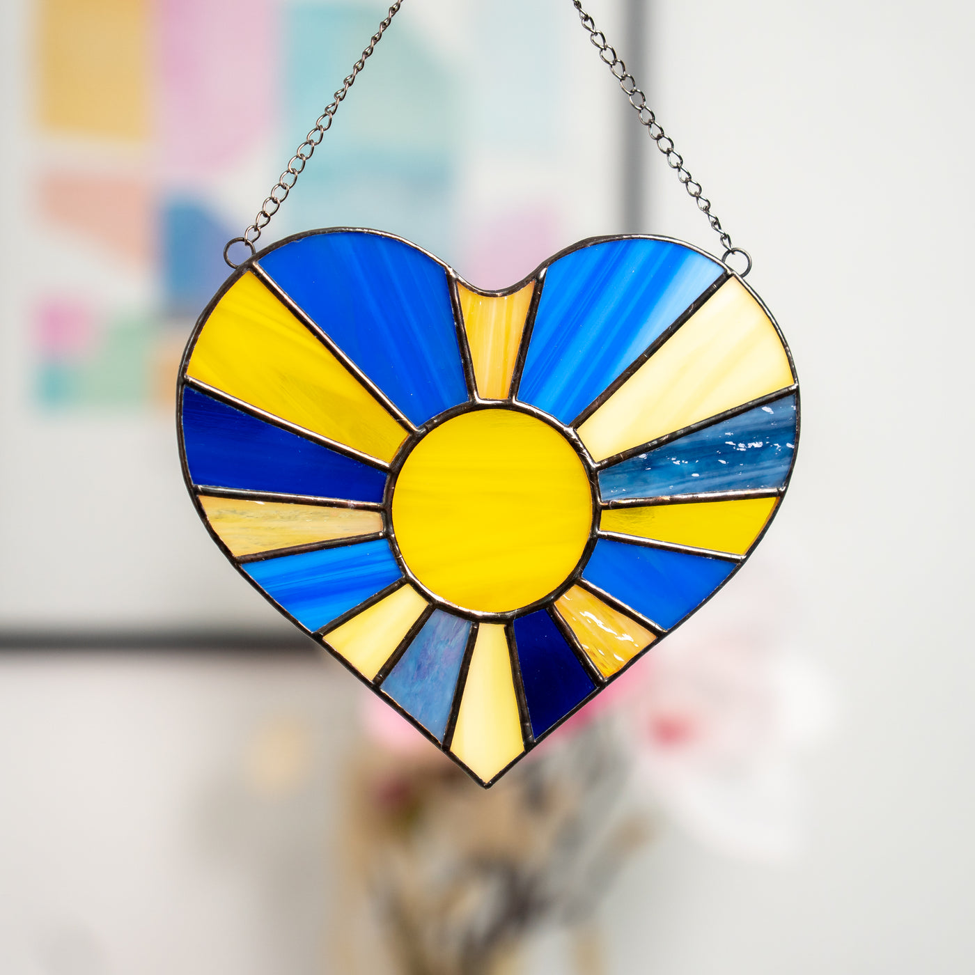Ukrainian heart with the sun-rays inside of it window hanging of stained glass