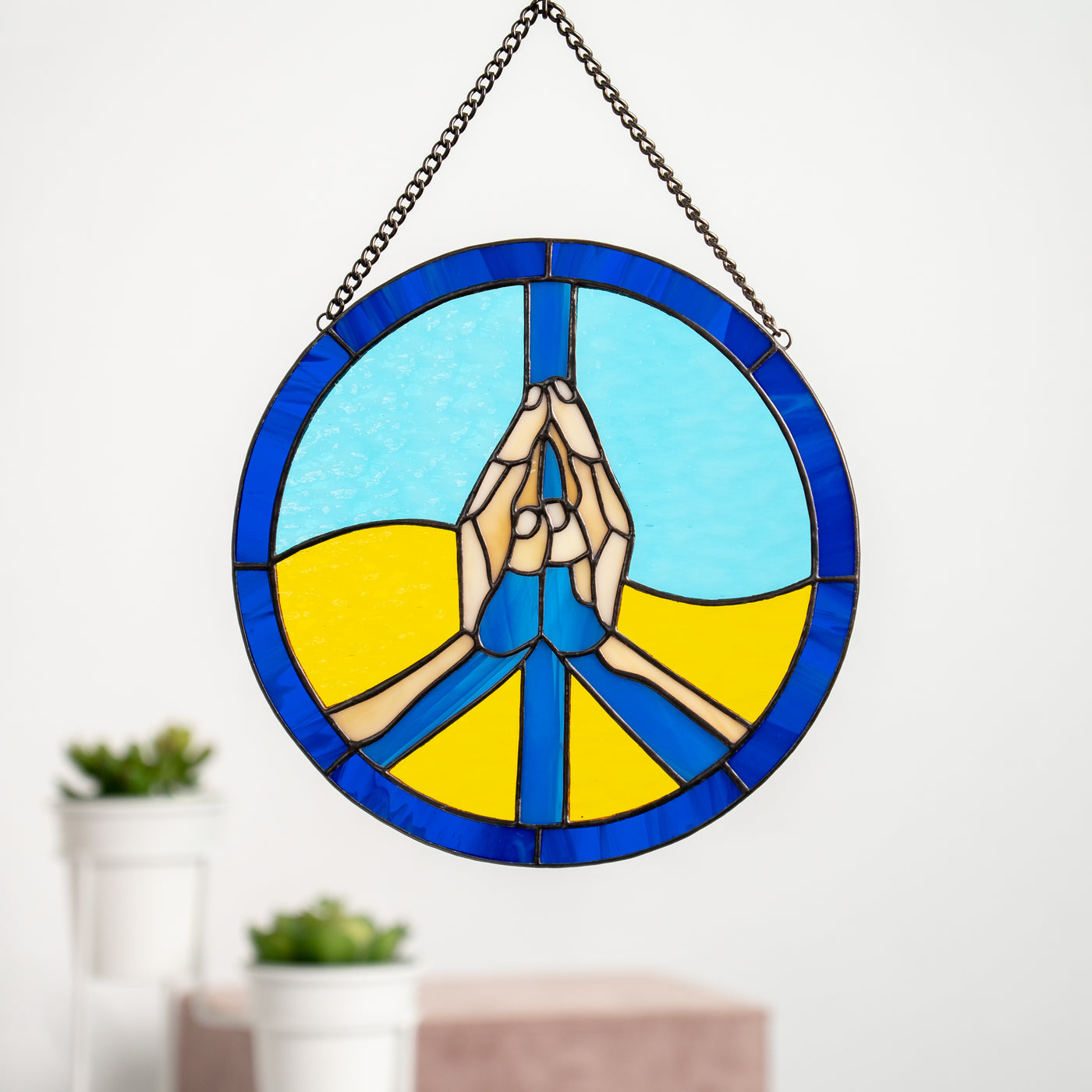Stained glass peace sign in the colours of Ukrainian flag window panel