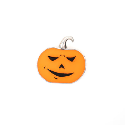 Stained glass pin of an orange Halloween pumpkin with triangle eyes