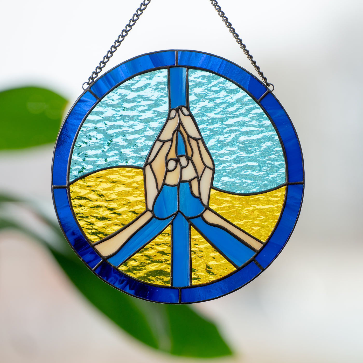 Zoomed stained glass Ukrainian peace window hanging 