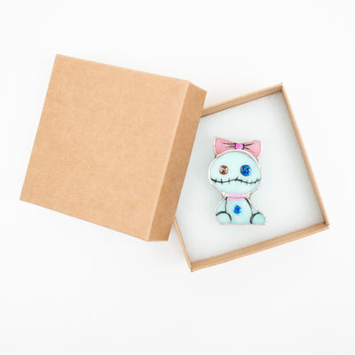 Stained glass turquoise toy pin in a brand box