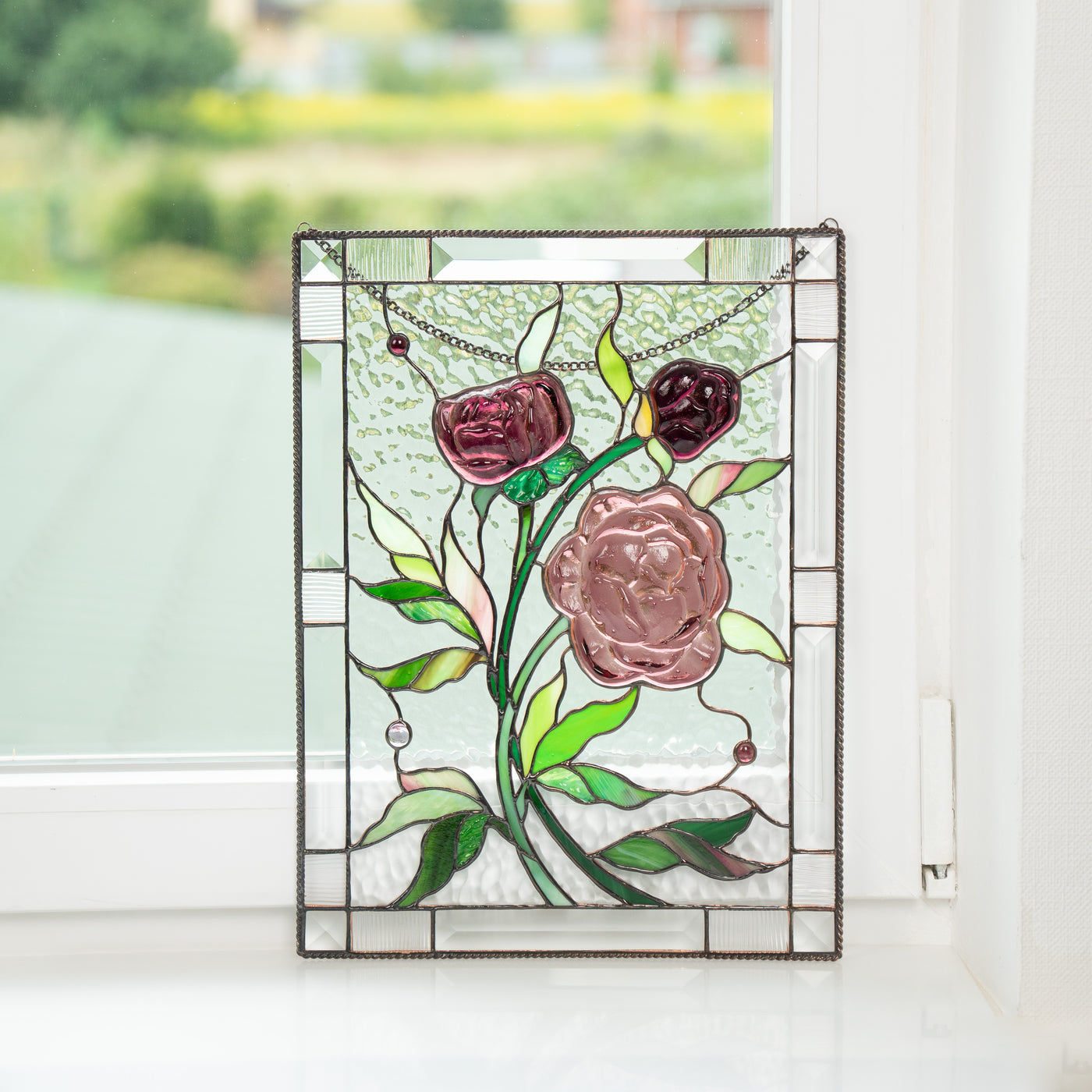 Stained glass window hanging depicting three peonies