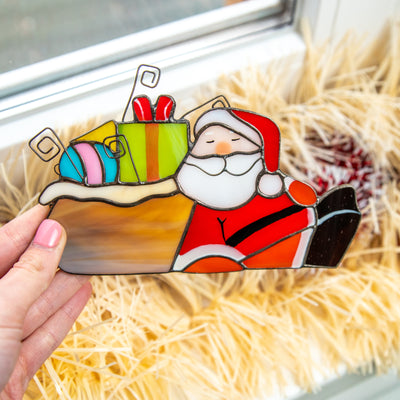 Bright and colourful stained glass Santa with the gifts suncatcher for home decor