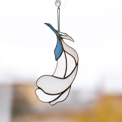 Stained glass white feather suncatcher with blue parts 