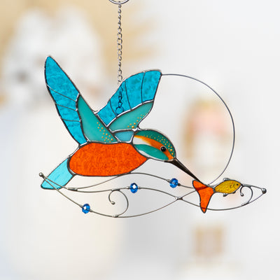 Stained glass kingfisher with the fish and drops of water suncatcher