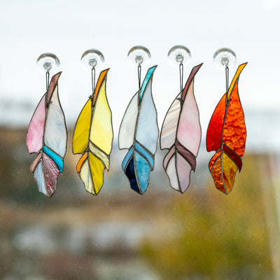 The collection of 5 stained glass feather suncatchers
