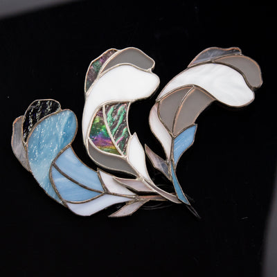 Three stained glass feathers suncatchers
