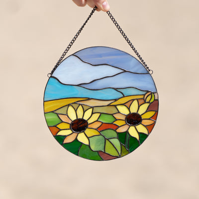 Zoomed panel depicting sunflowers and blue skies of stained glass