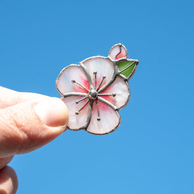 Stained glass brooch of a sakura blossom flower 