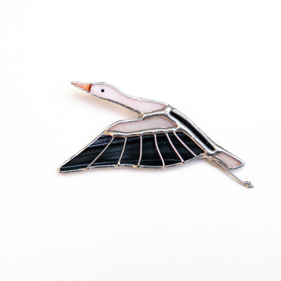 Stained glass flying stork with the wings down brooch