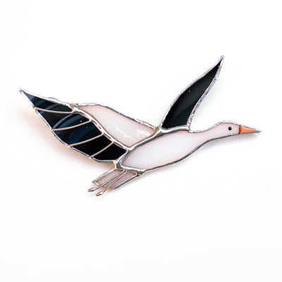 Stained glass flying right stork brooch