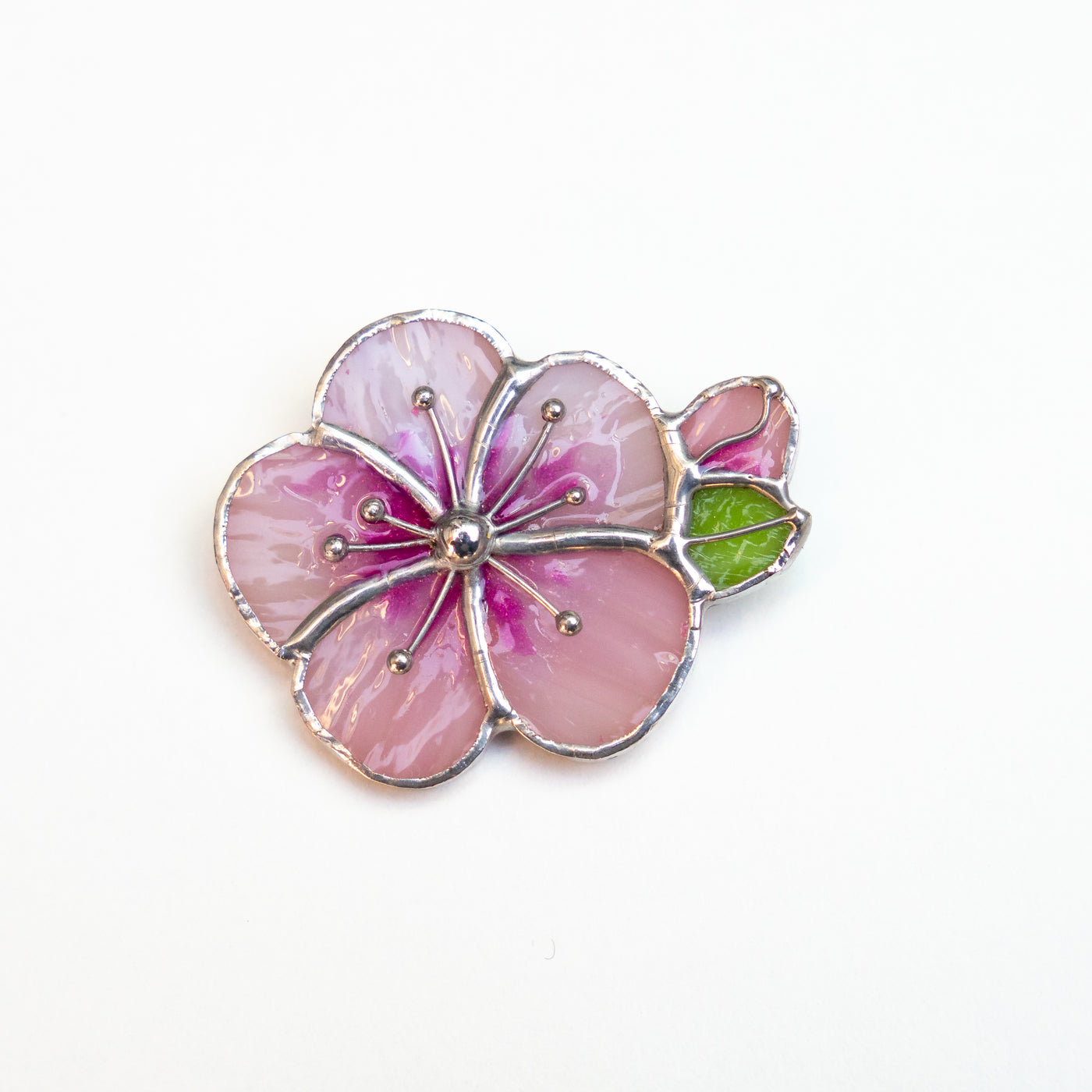 Apricot blossom flower with a green leaf brooch of stained glass