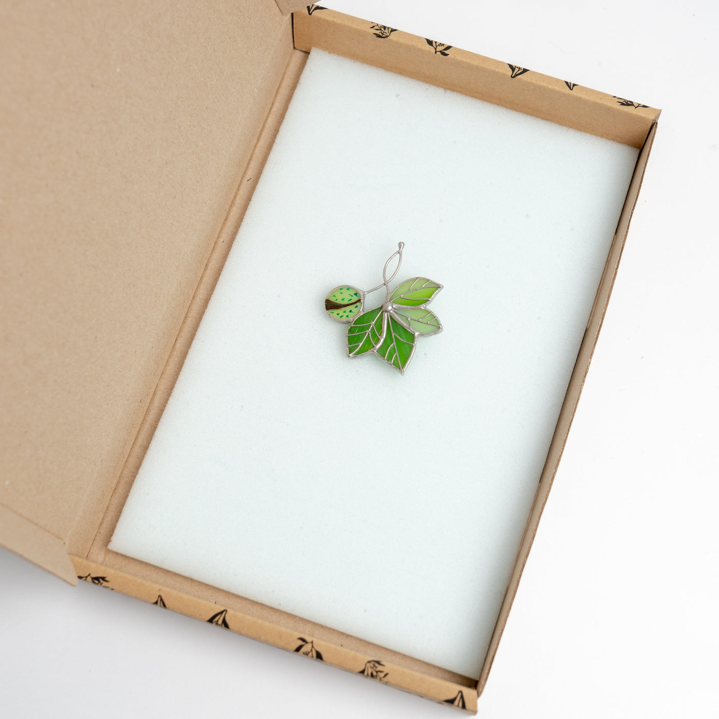 Stained glass chestnut with the leaves brooch in a brandbox