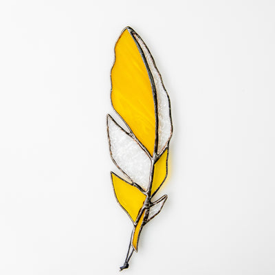 Bright yellow stained glass feather window hanging
