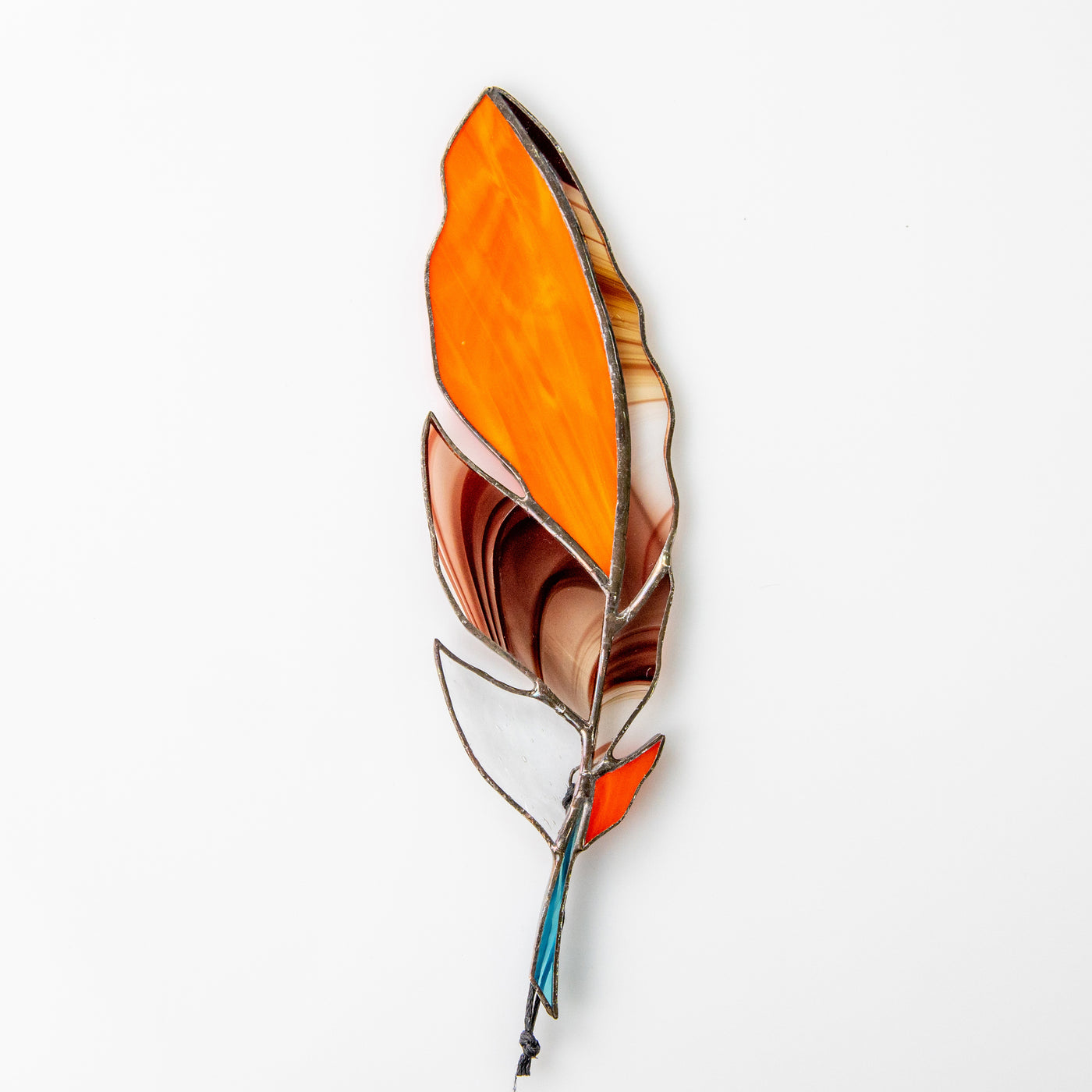 Stained glass orange feather suncatcher with bardic blotchiness