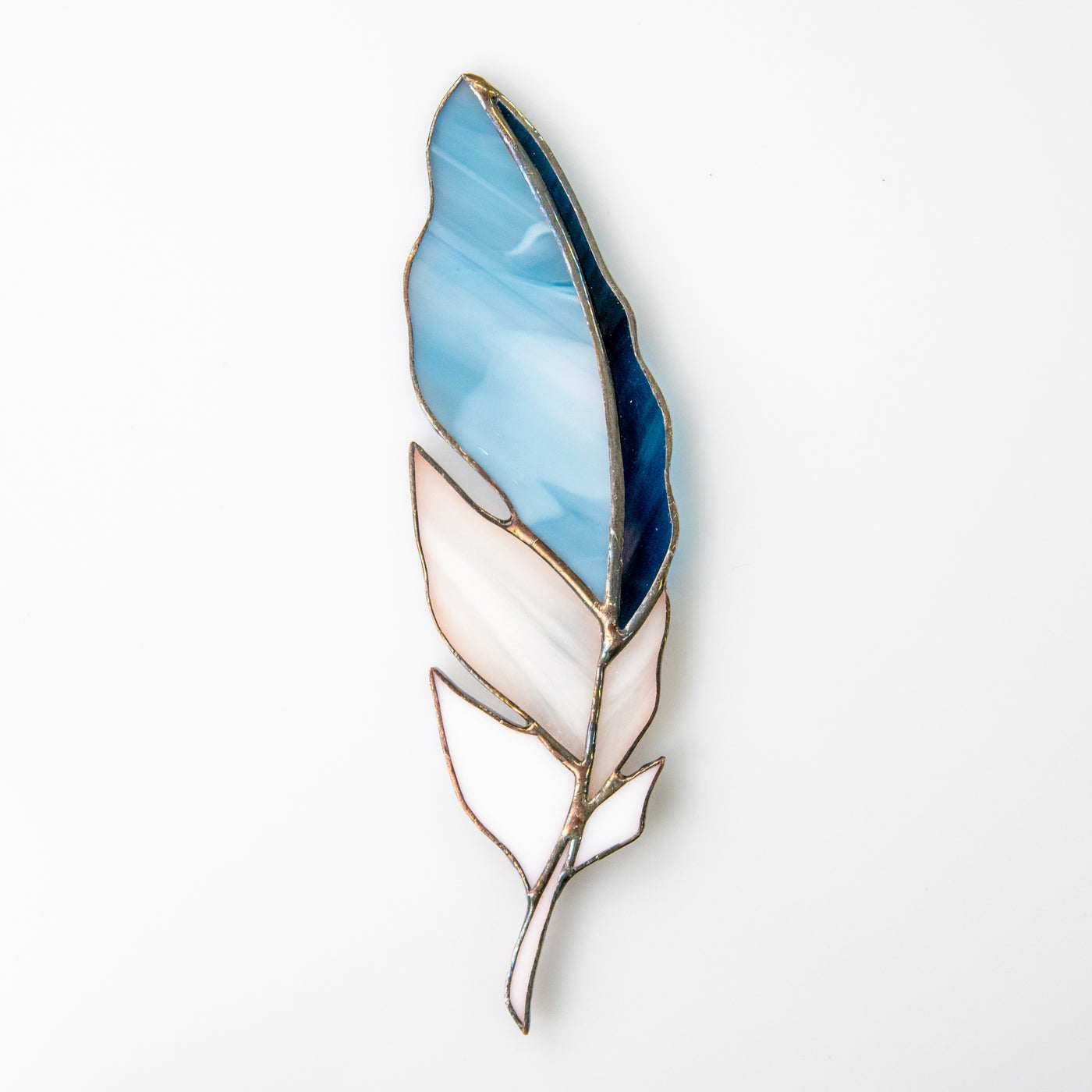 Suncatcher of a stained glass sky-blue  with white and navy colours feather